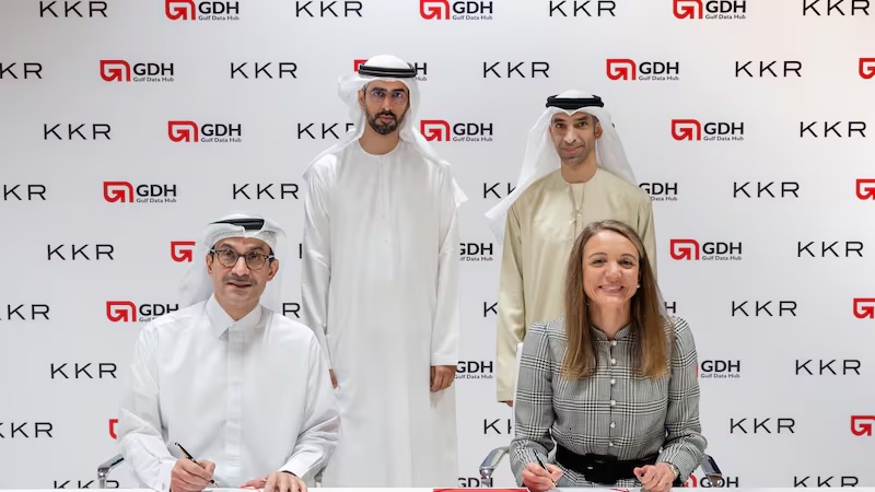 Omar Al Olama, Minister of State for AI, Digital Economy and Remote Work Applications, and Dr Thani Al Zeyoudi, Minister of State for Foreign Trade, witness the signing of the agreement by Tarek Al Ashram, chief executive of Gulf Data Hub, and Tara Davies, co-head of KKR Europe, Middle East and Africa. Photo: KKR / GDH