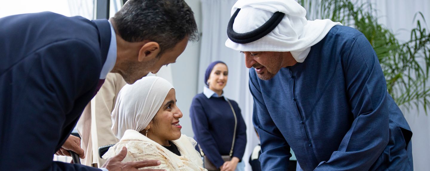 HH Sheikh Mohamed Bin Zayed Al Nahyan with a child in a wheelchair at the Children's National Hospital 